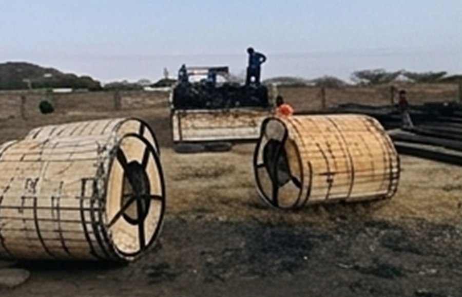 Large wooden cable drums on site